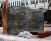 This is a picture of the statue, Kryptos, in front of the CIA building.